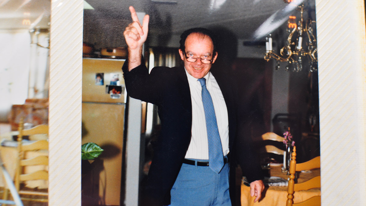 Bold photo of grandpa with hand in air giving advice